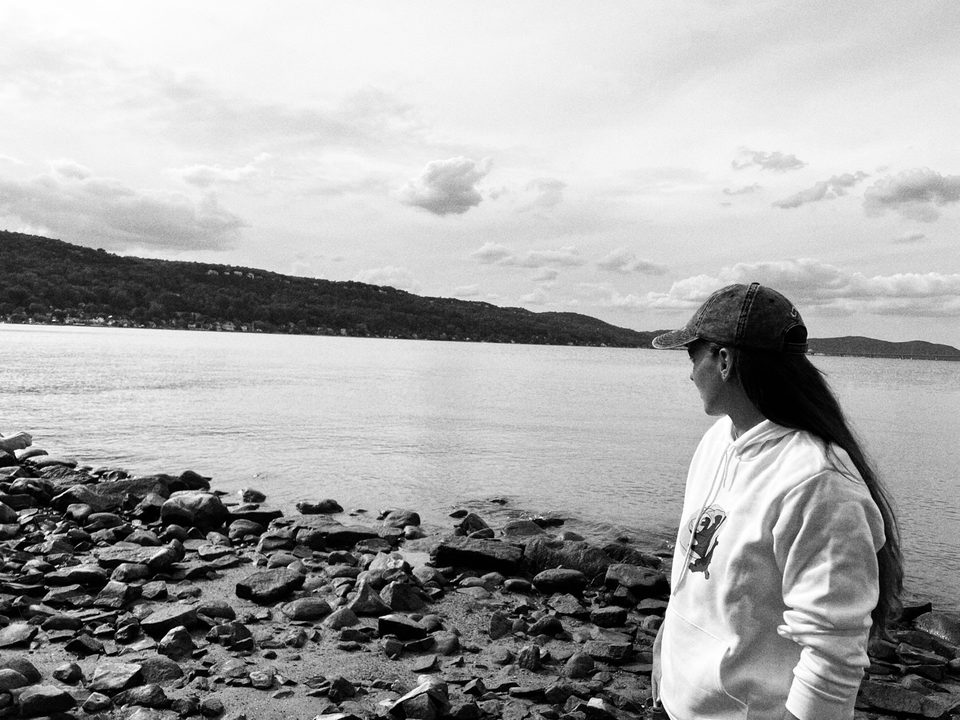 Someone in a CBX hoodie, looking out over the river